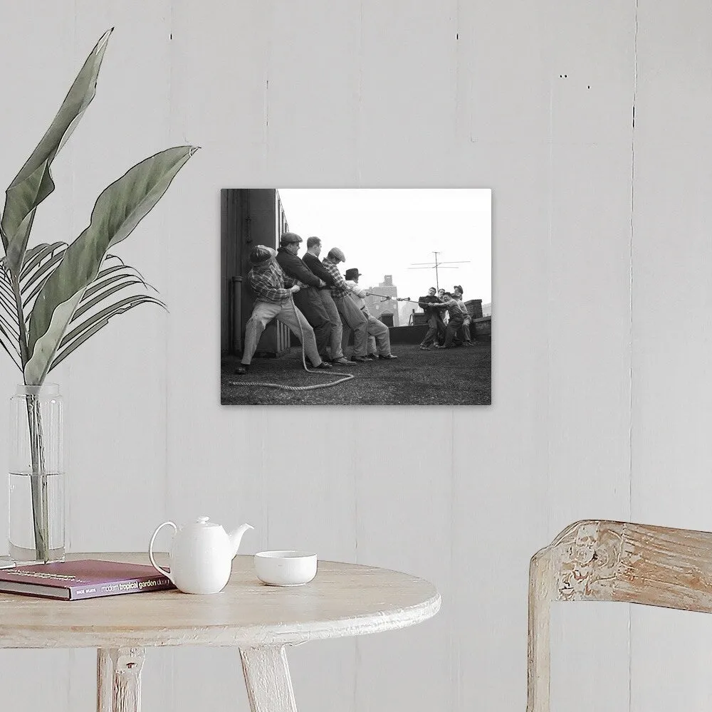 "1950's Two Groups Of Five Men Each Pulling On Tug-Of-War Rope On Building Roo" Canvas Wall Art